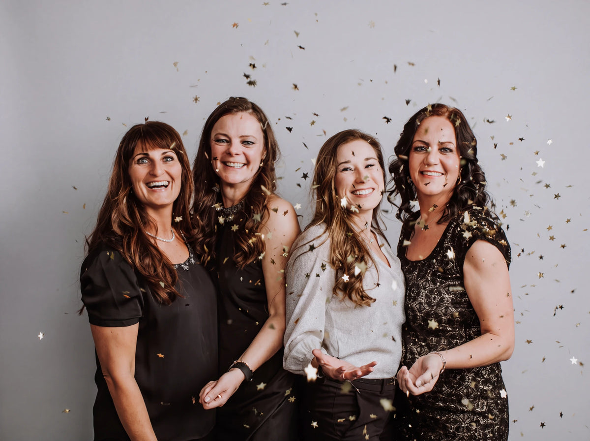 The four Ruvely founders celebrating with confetti