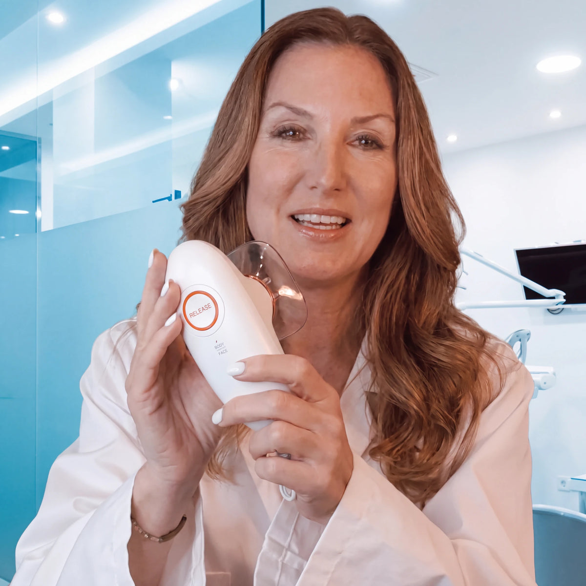 Dermatologist holding the Ruvely 3.0 in a clinic